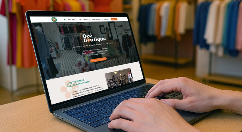 Mockup d’un site web Océ Boutique affiché sur un ordinateur portable dans une boutique de prêt-à-porter
